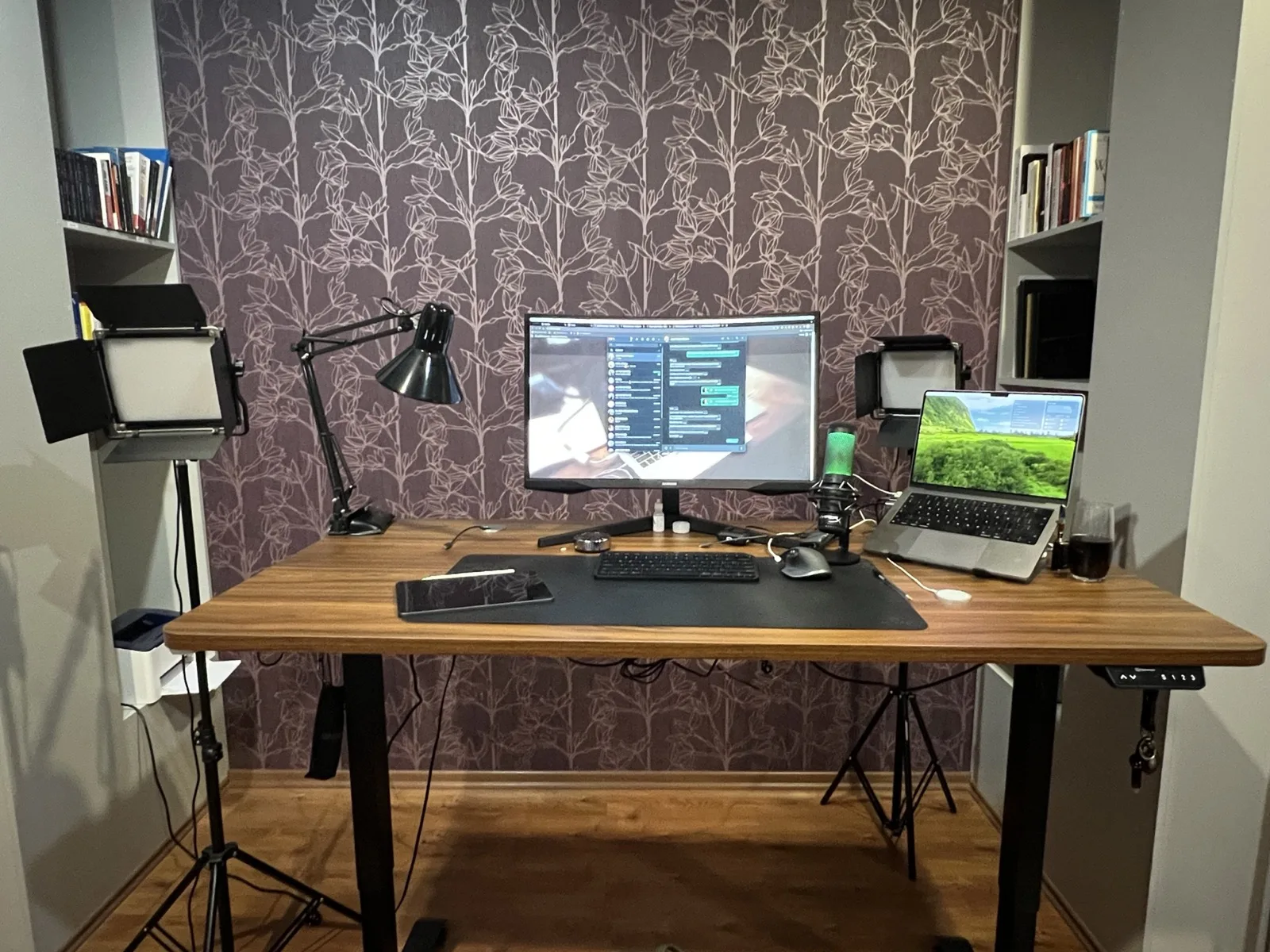 Office with electric standing desk setup